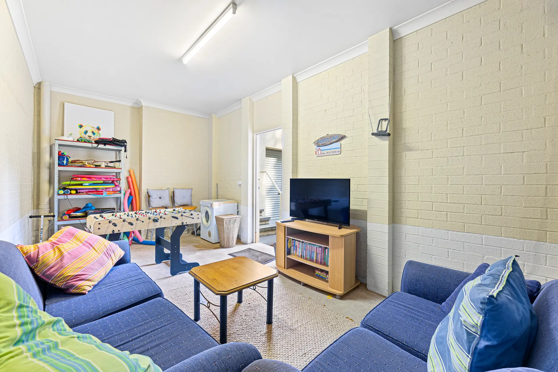 Family games room with table games and television at Bec’s Beach House