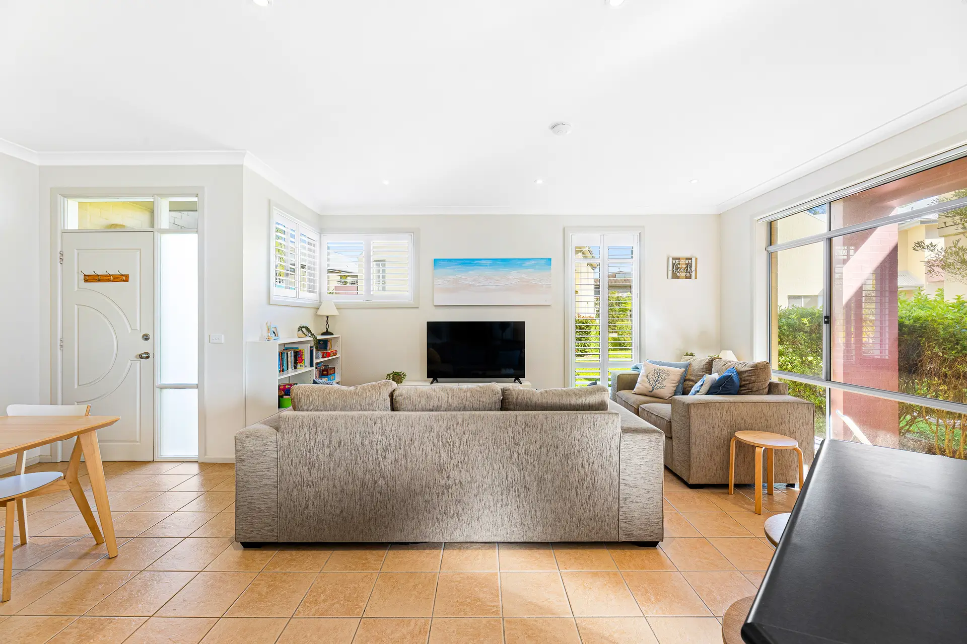Bright family living room at Bec’s Beach House